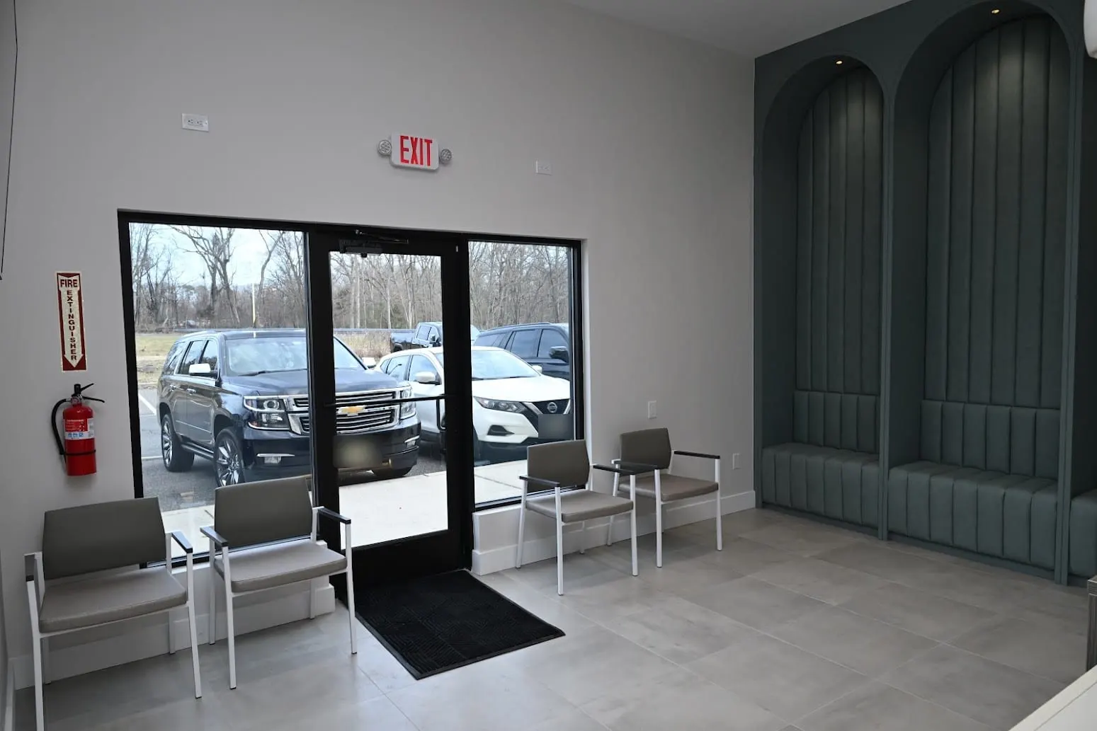 Waiting area with seating and the front entrance at Alpine Dental in Jackson, NJ