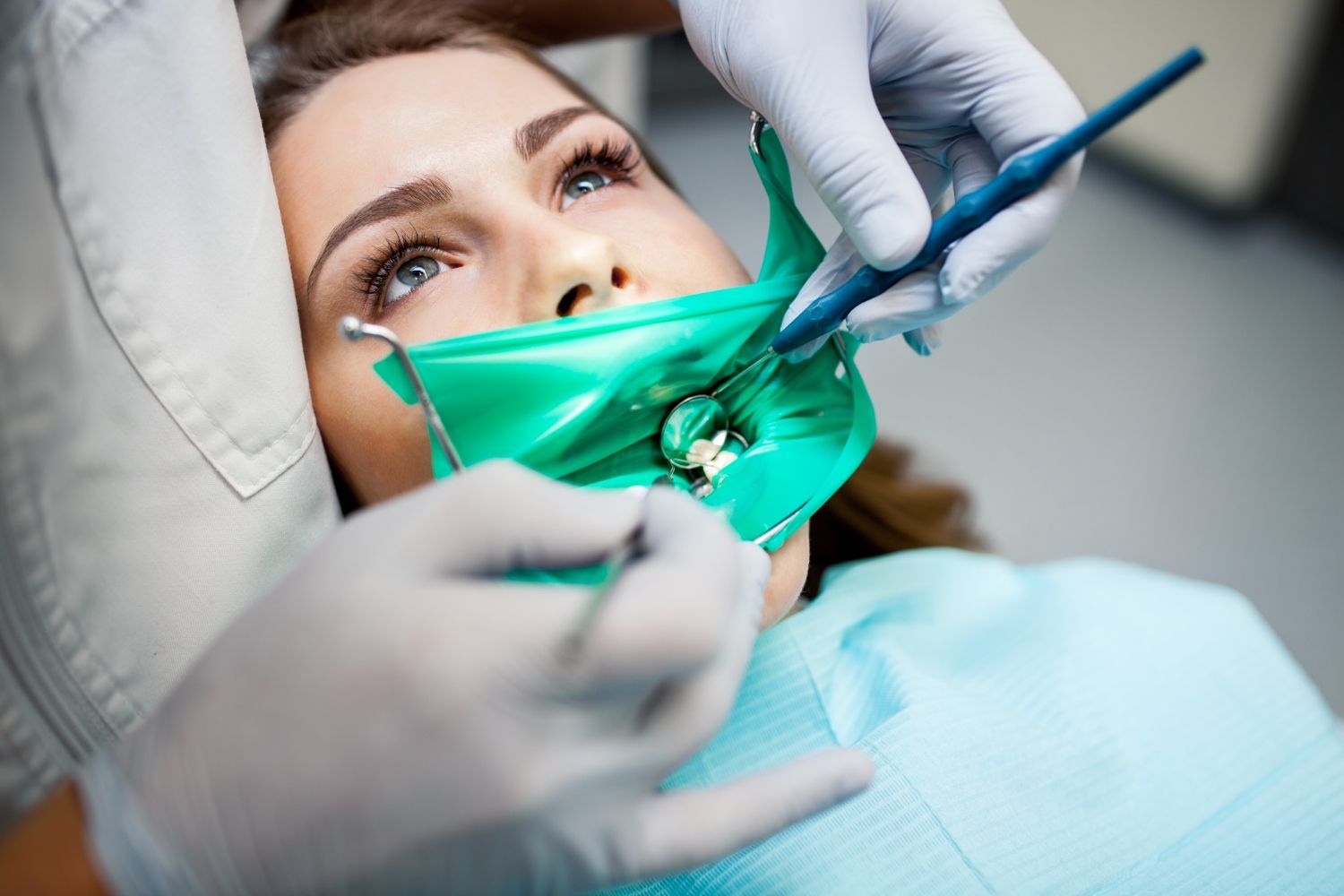 Dentist performing root canal treatment
